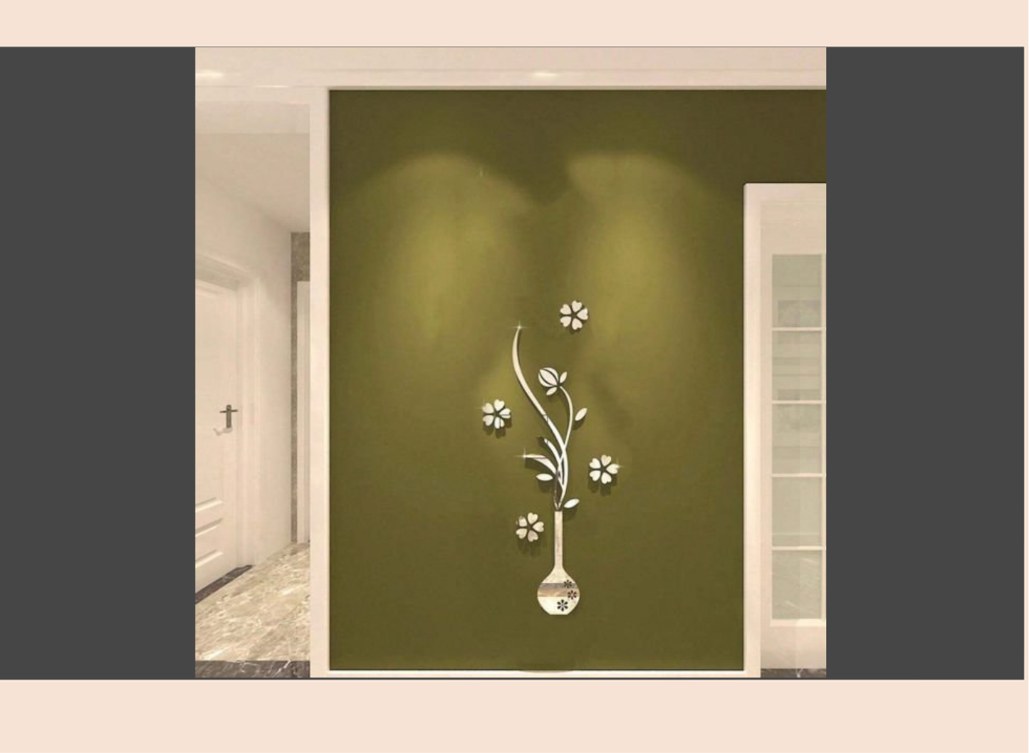 Decorative wall sticker with floral design on a green wall.