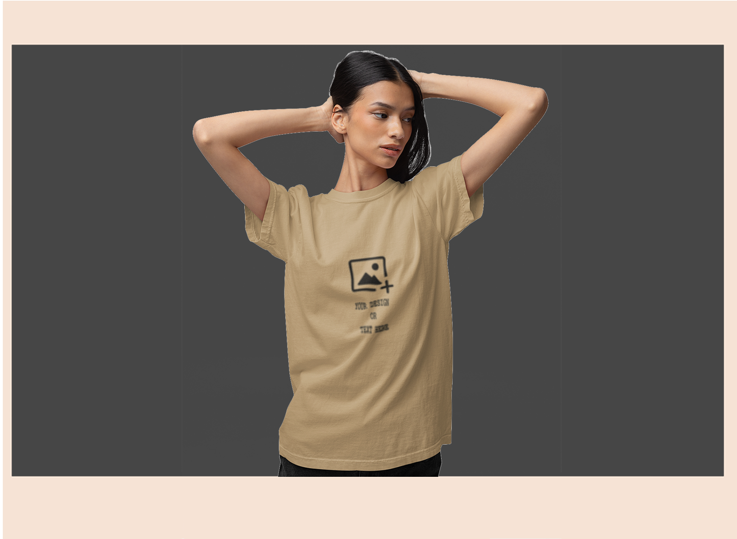Woman wearing a beige t-shirt with a graphic design on a dark background