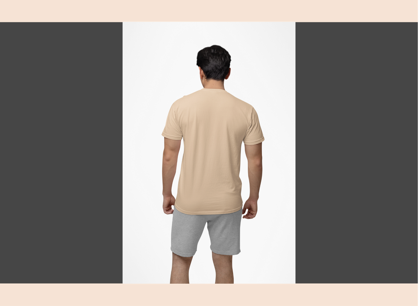 Man wearing a beige t-shirt and gray shorts on a white background