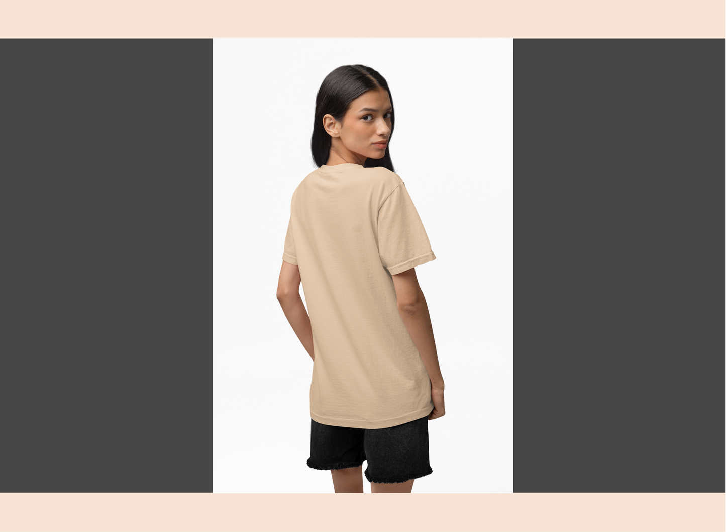 Woman wearing a beige t-shirt and black shorts on a white background