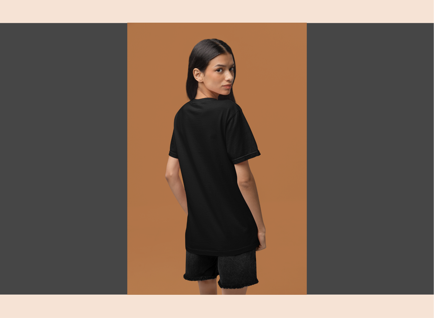 Person wearing a black t-shirt and shorts on a brown and gray background