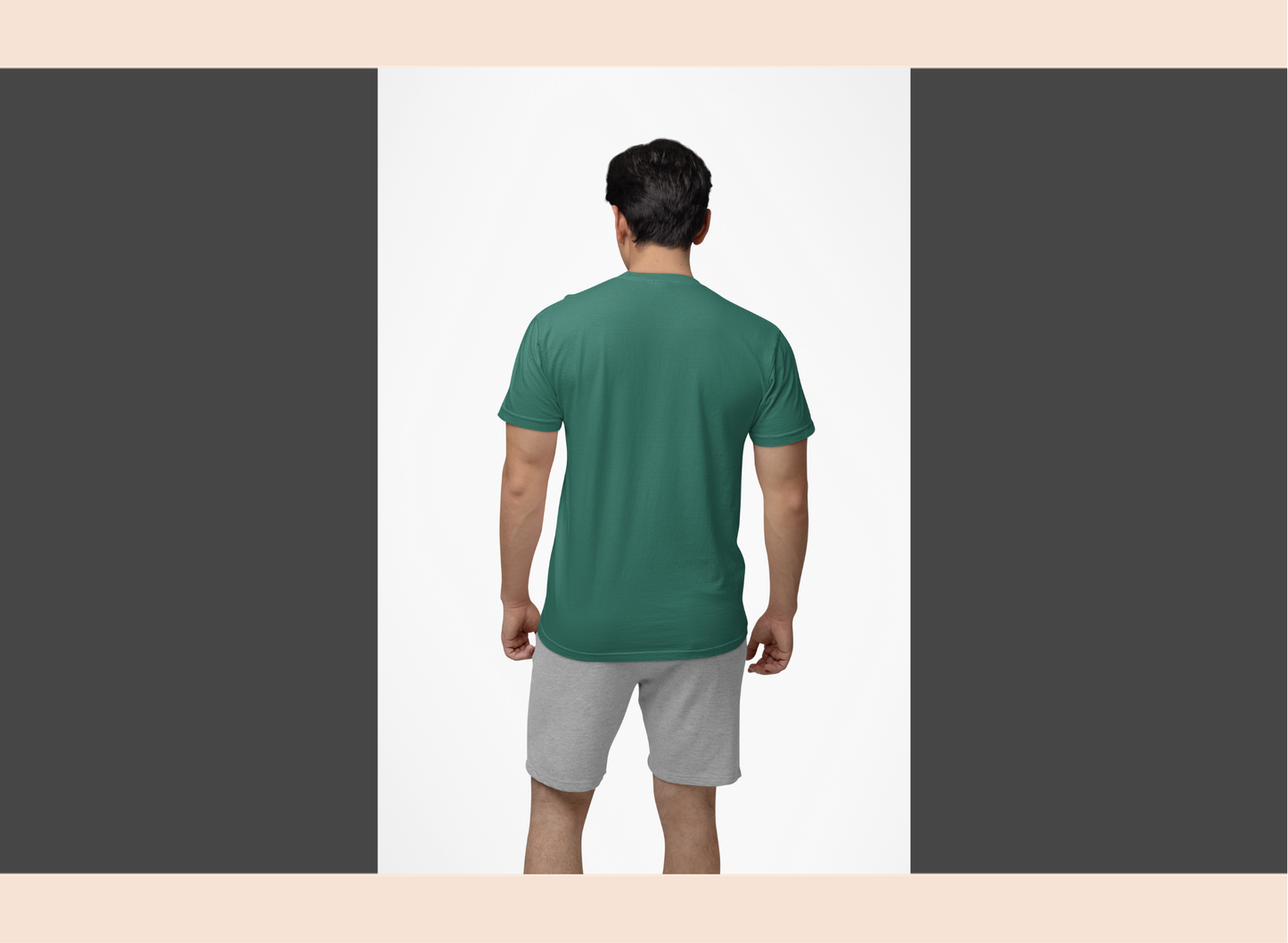 Man wearing a green t-shirt and gray shorts on a white background