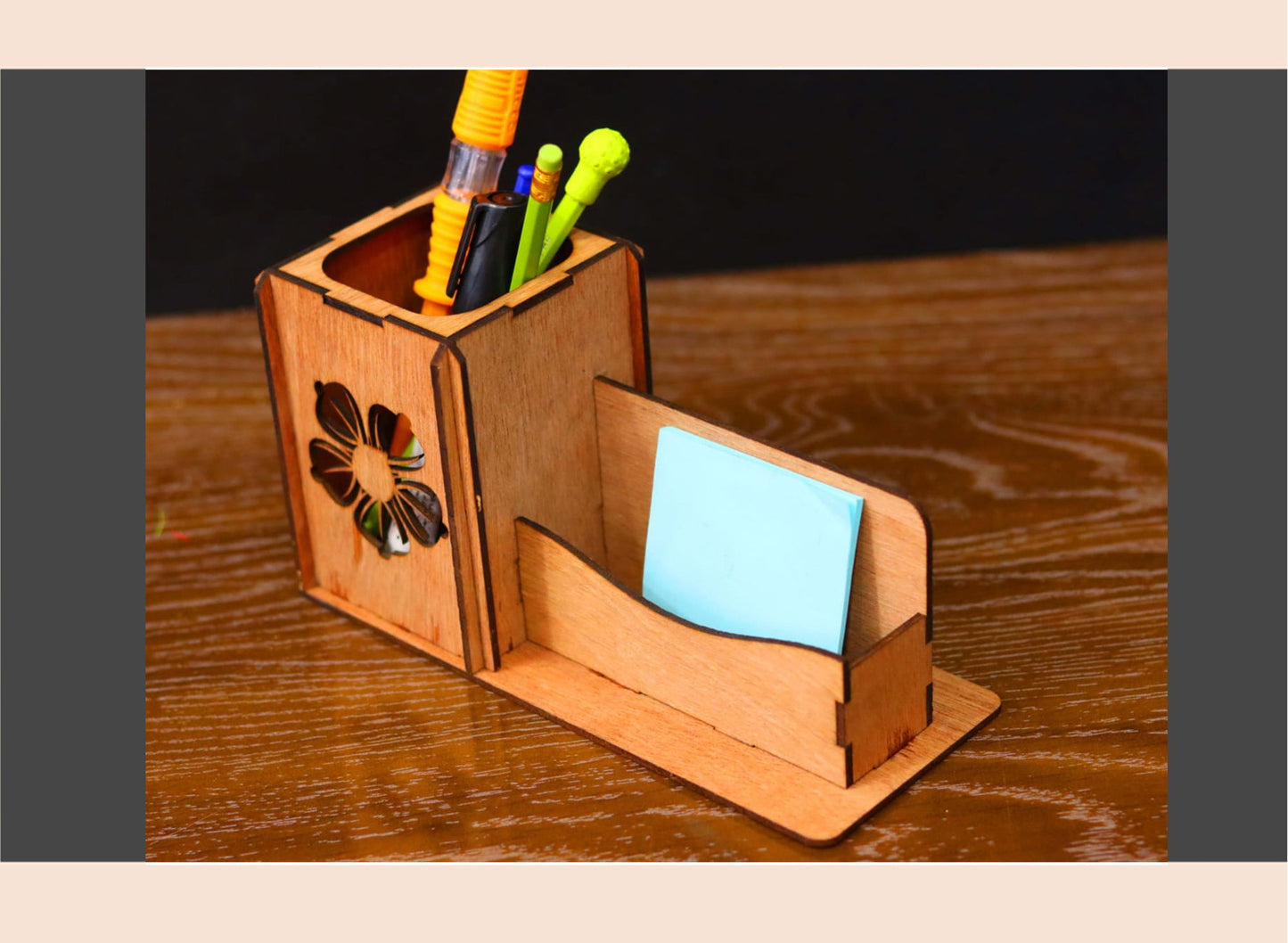 Wooden desk organizer with pen holder and card slot on a wooden surface