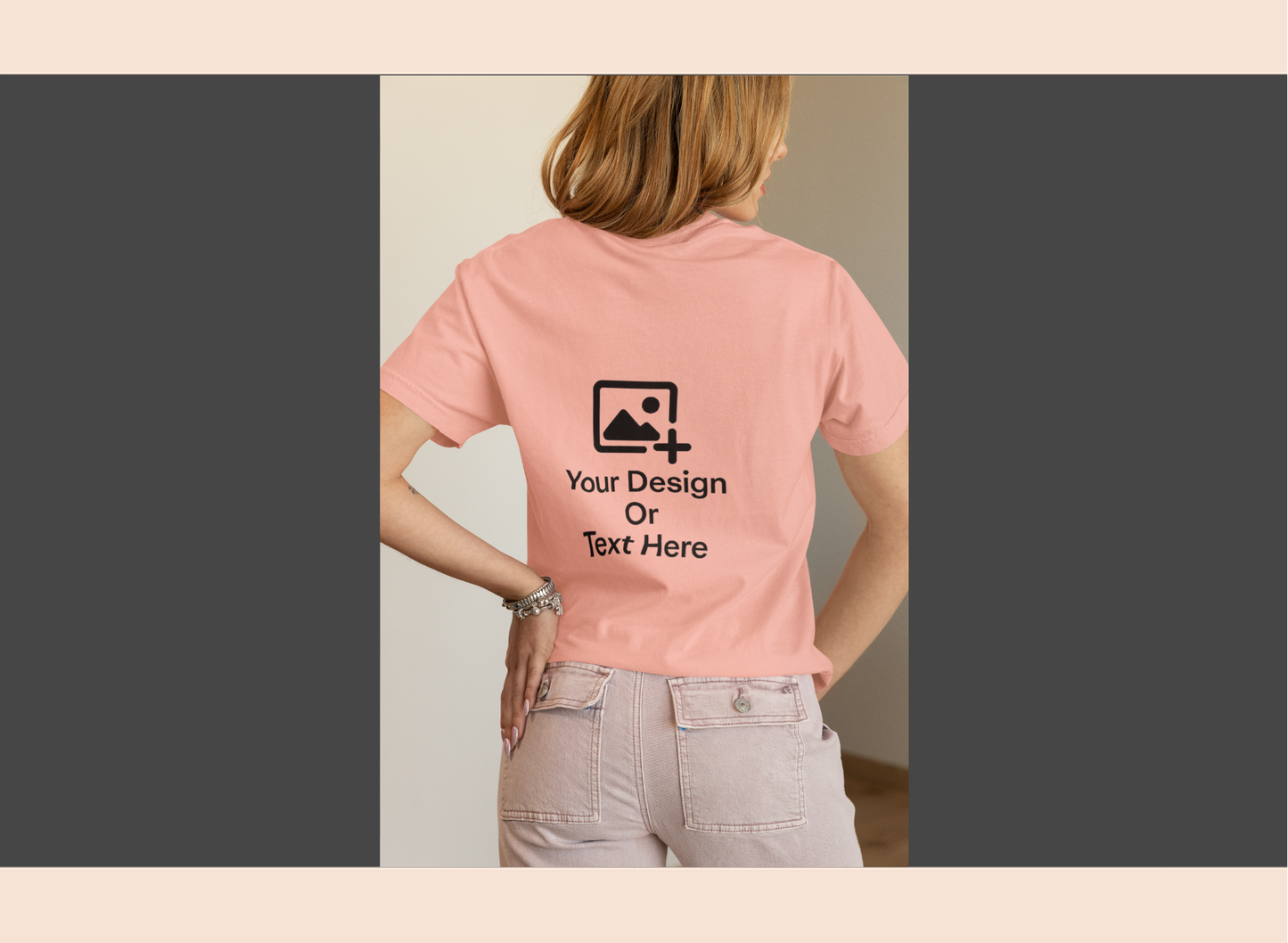 Person wearing a pink t-shirt with customizable text and design area on the back.