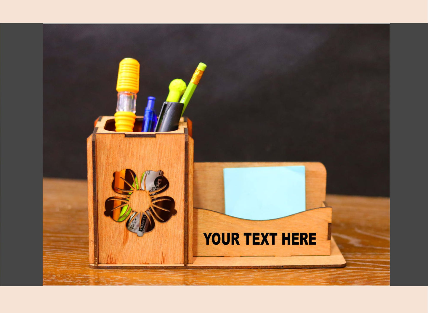Wooden pen holder with colorful pens and a small notepad on a wooden surface.