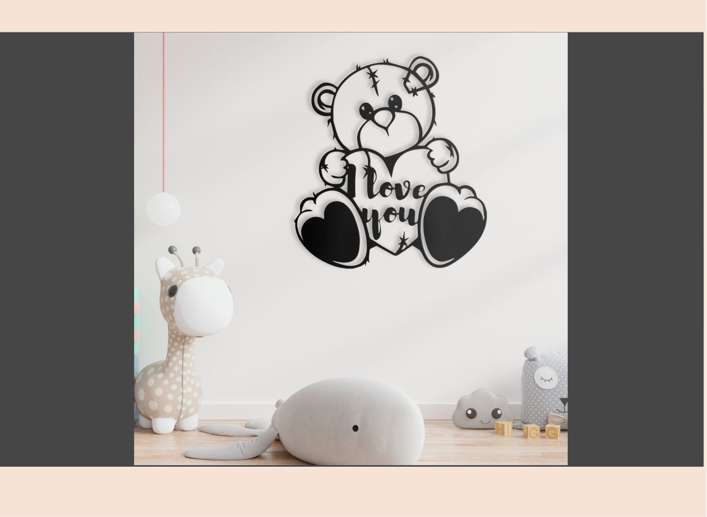Decorative wall sticker of a teddy bear with 'I love you' text on a white wall.