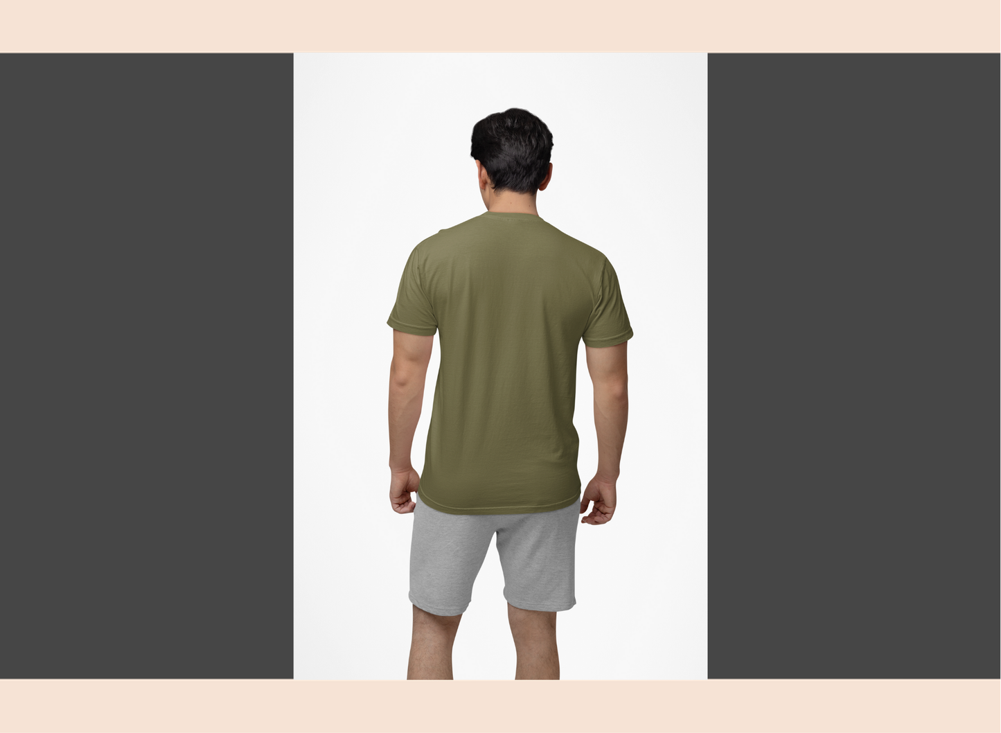 Man wearing a green t-shirt and gray shorts on a white background