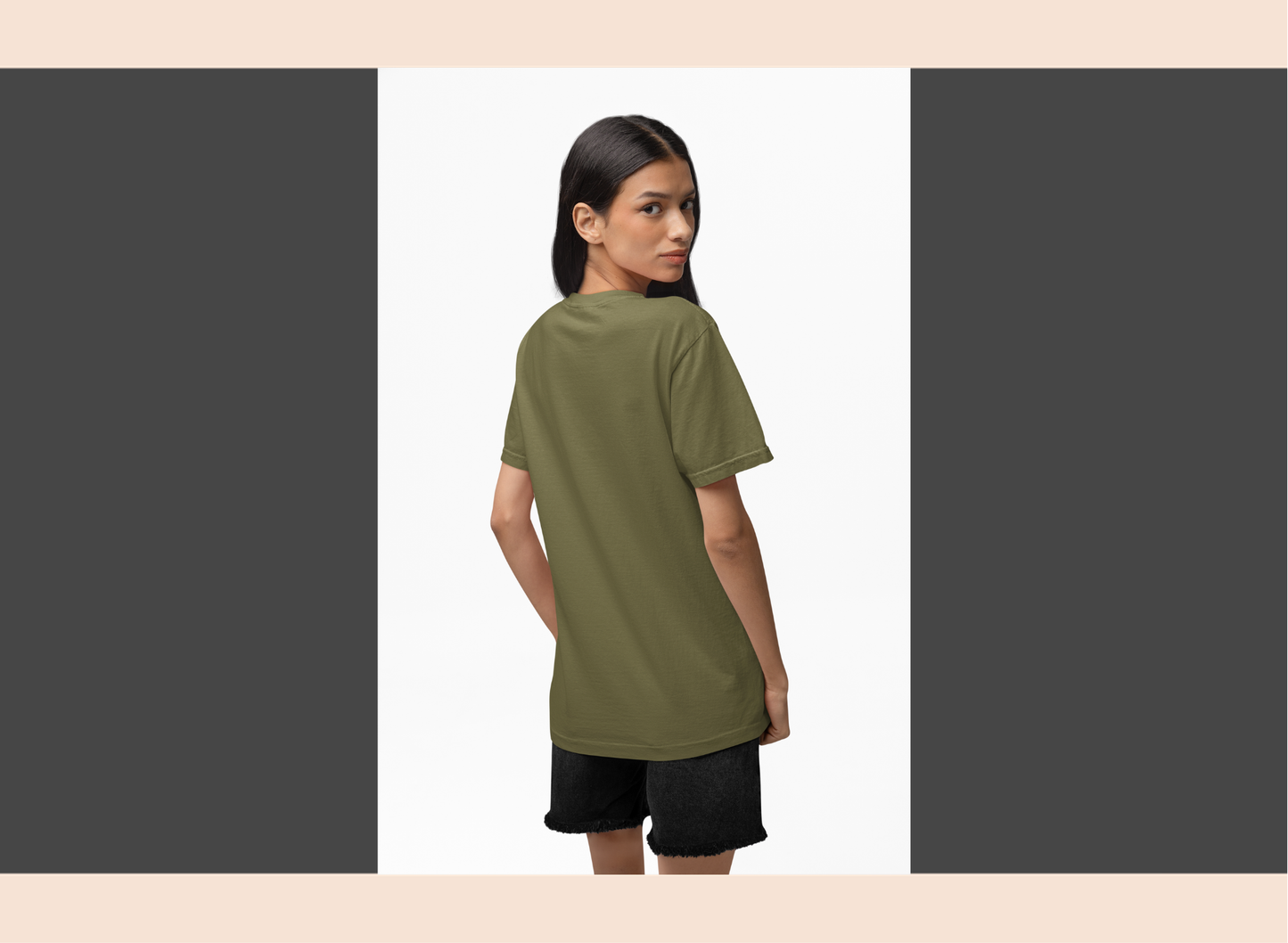 Woman wearing an olive green t-shirt and black shorts on a white background