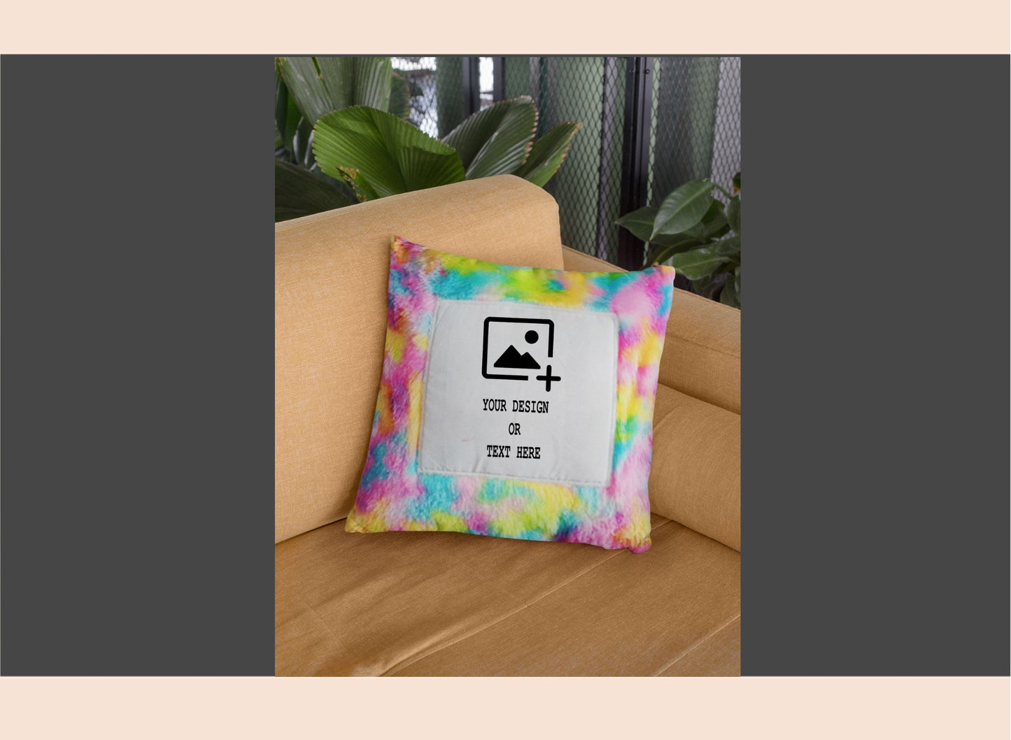 Colorful tie-dye pillow with a customizable design on a beige couch.