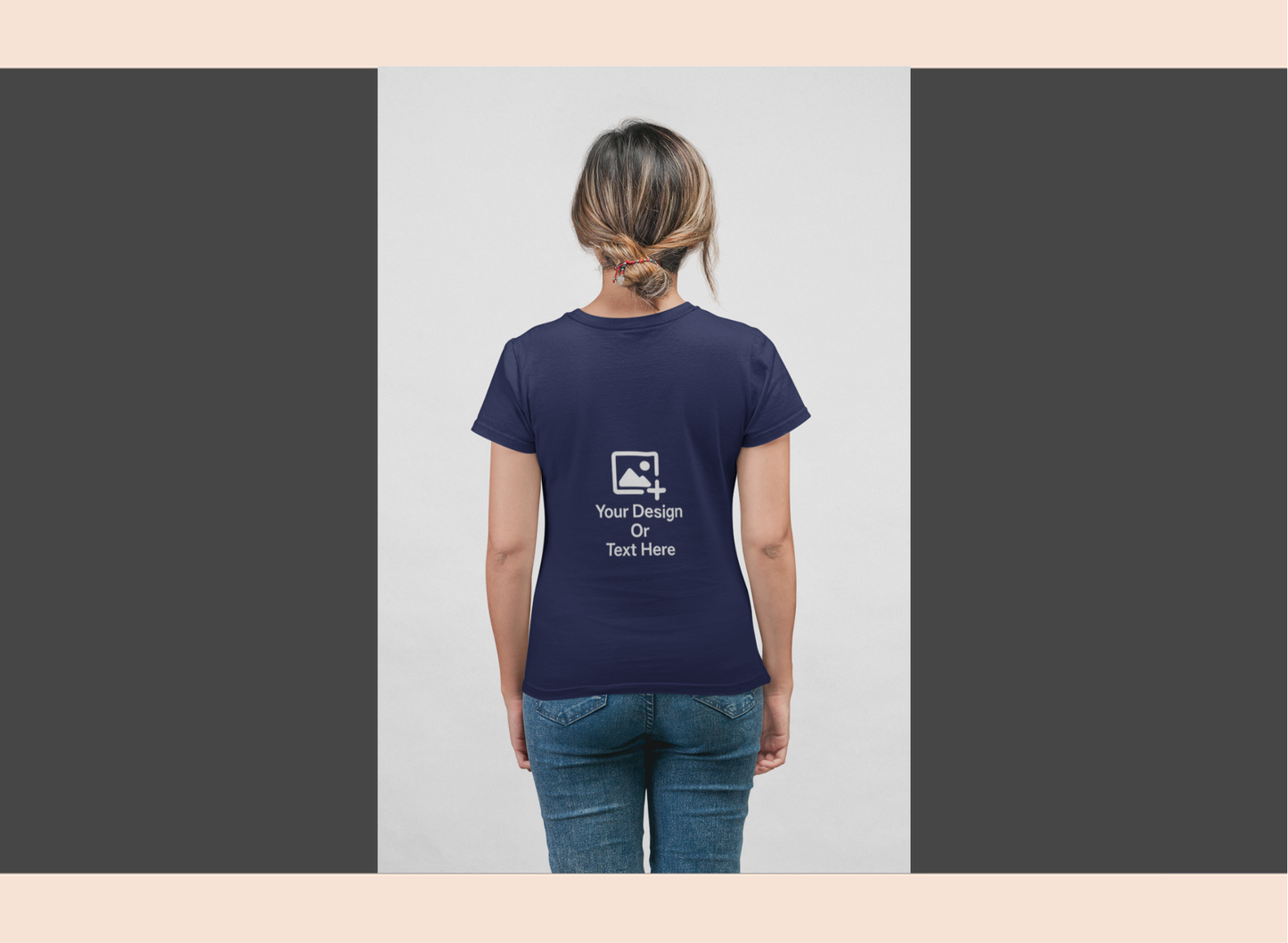Person wearing a navy blue t-shirt with a design and text on the back, standing against a plain background.