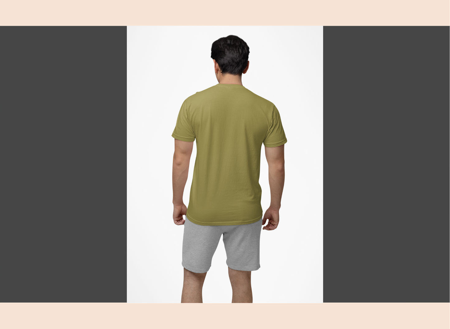 Man wearing a green t-shirt and gray shorts on a white background