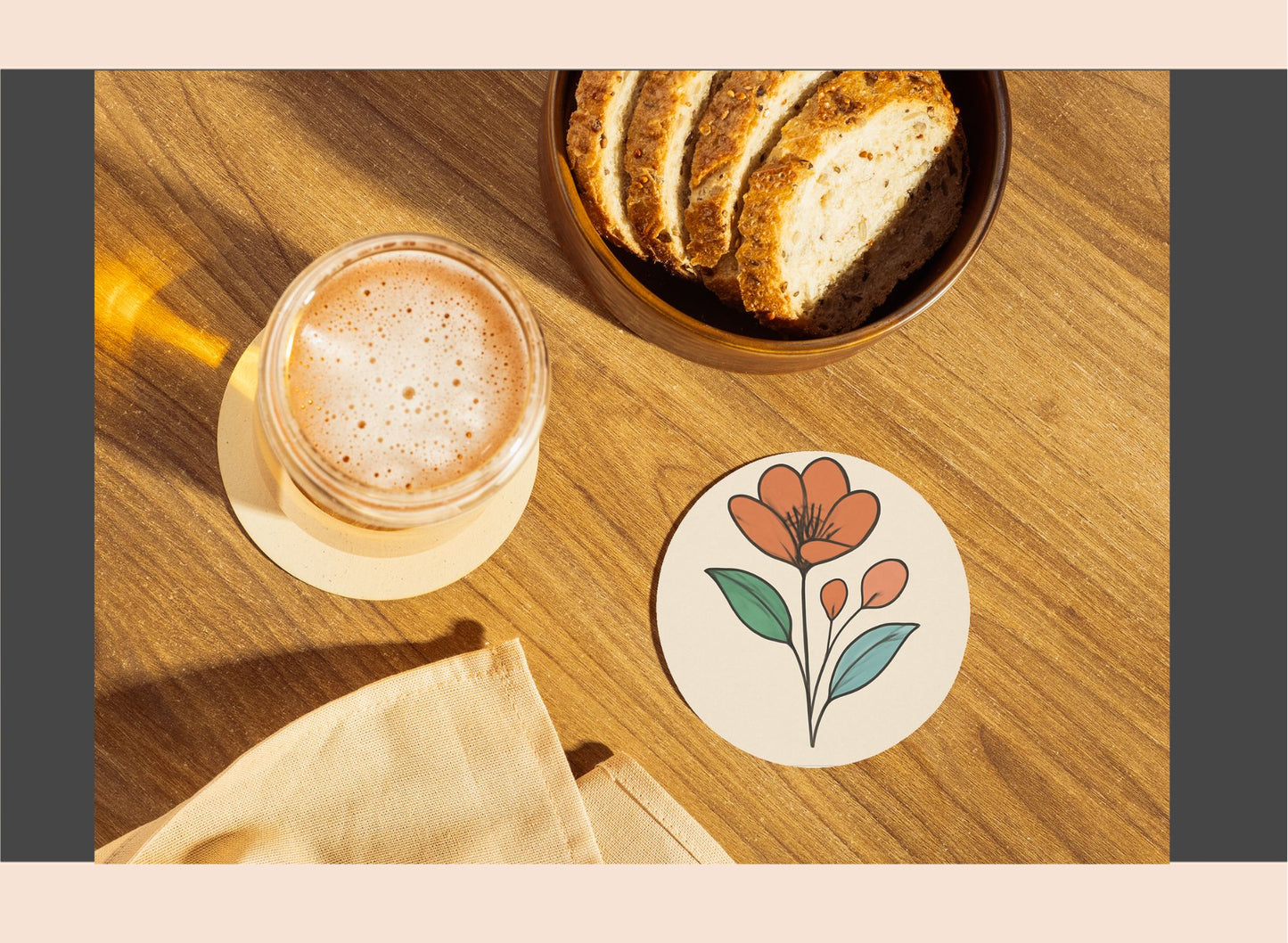 Cup of coffee, bread slices, and a floral coaster on a wooden surface