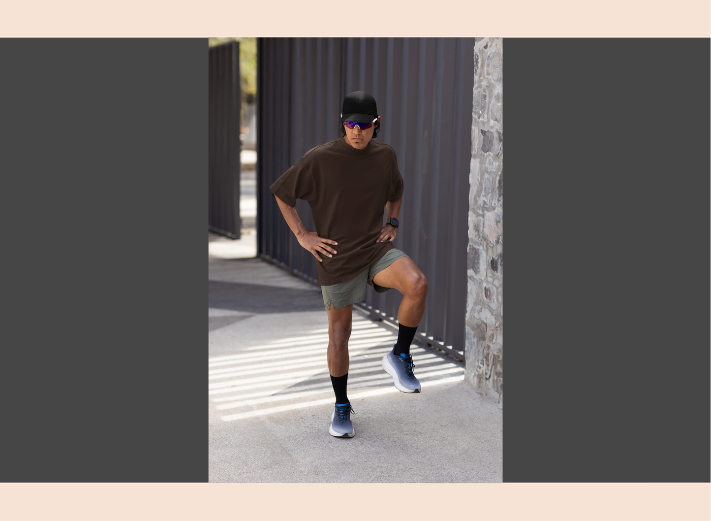 Person in athletic wear posing outdoors on a sunny day