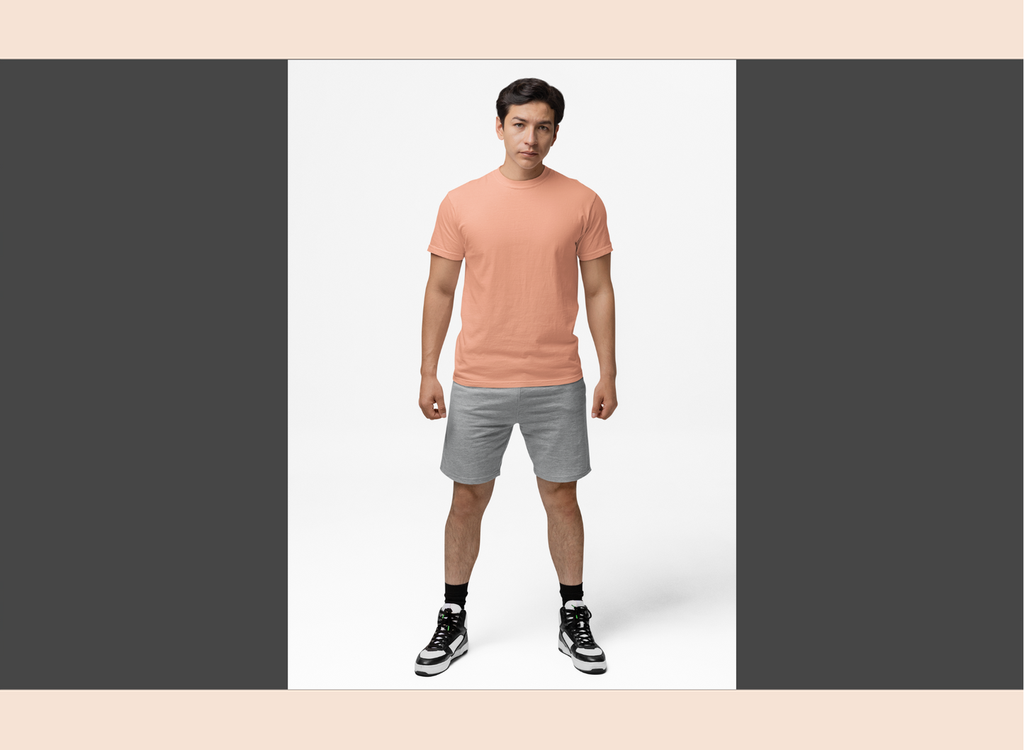 Man wearing a peach t-shirt on a white background