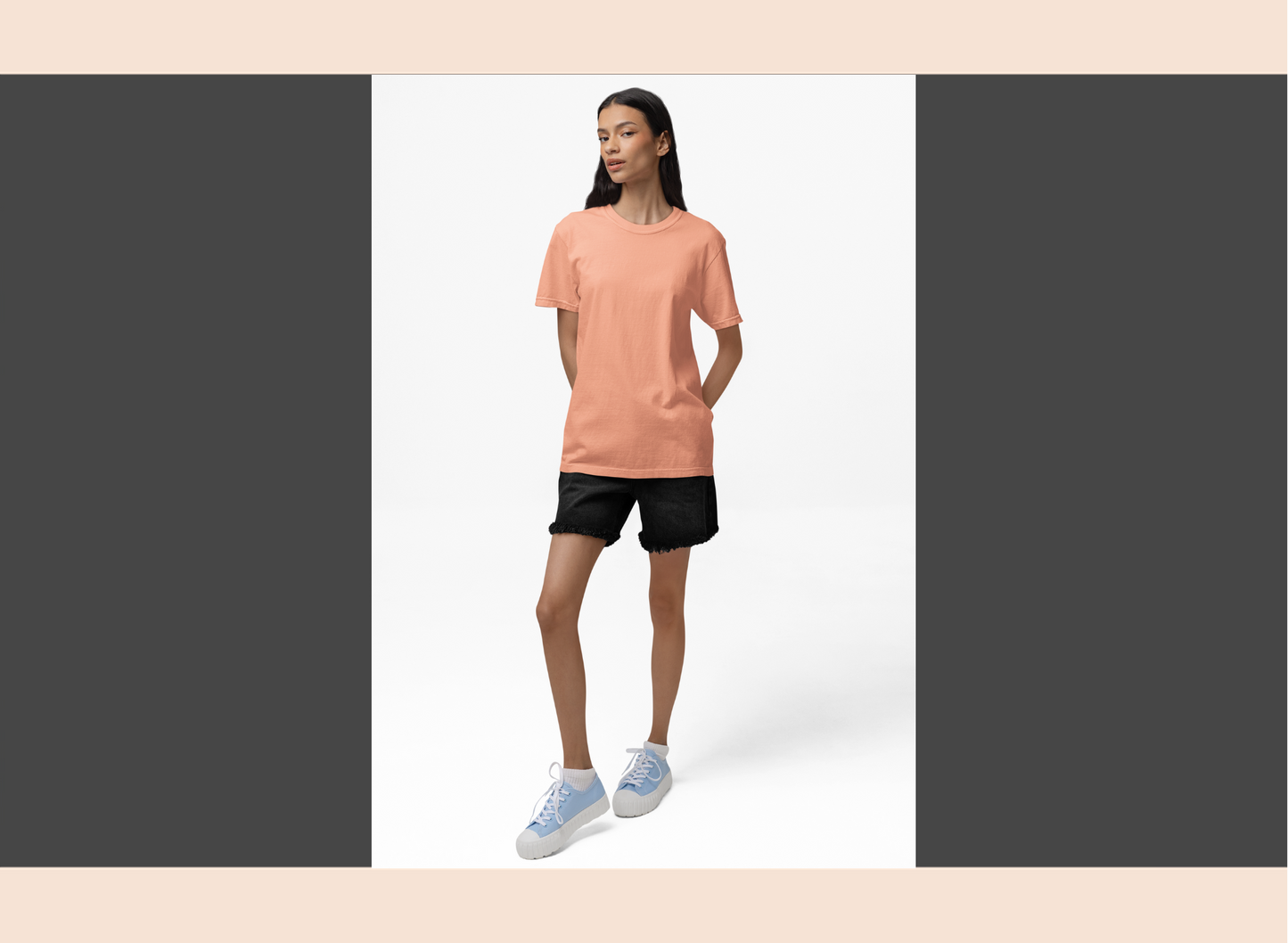 Woman wearing a peach t-shirt on a white background