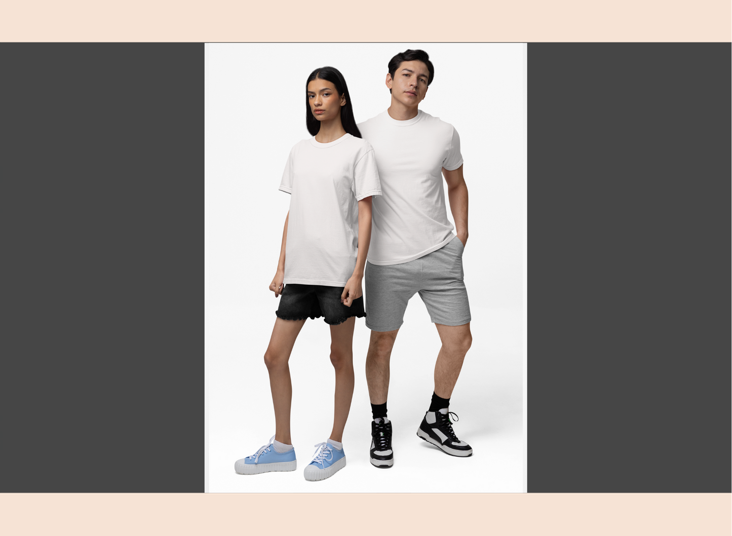 Two people wearing white t-shirts and shorts on a plain background