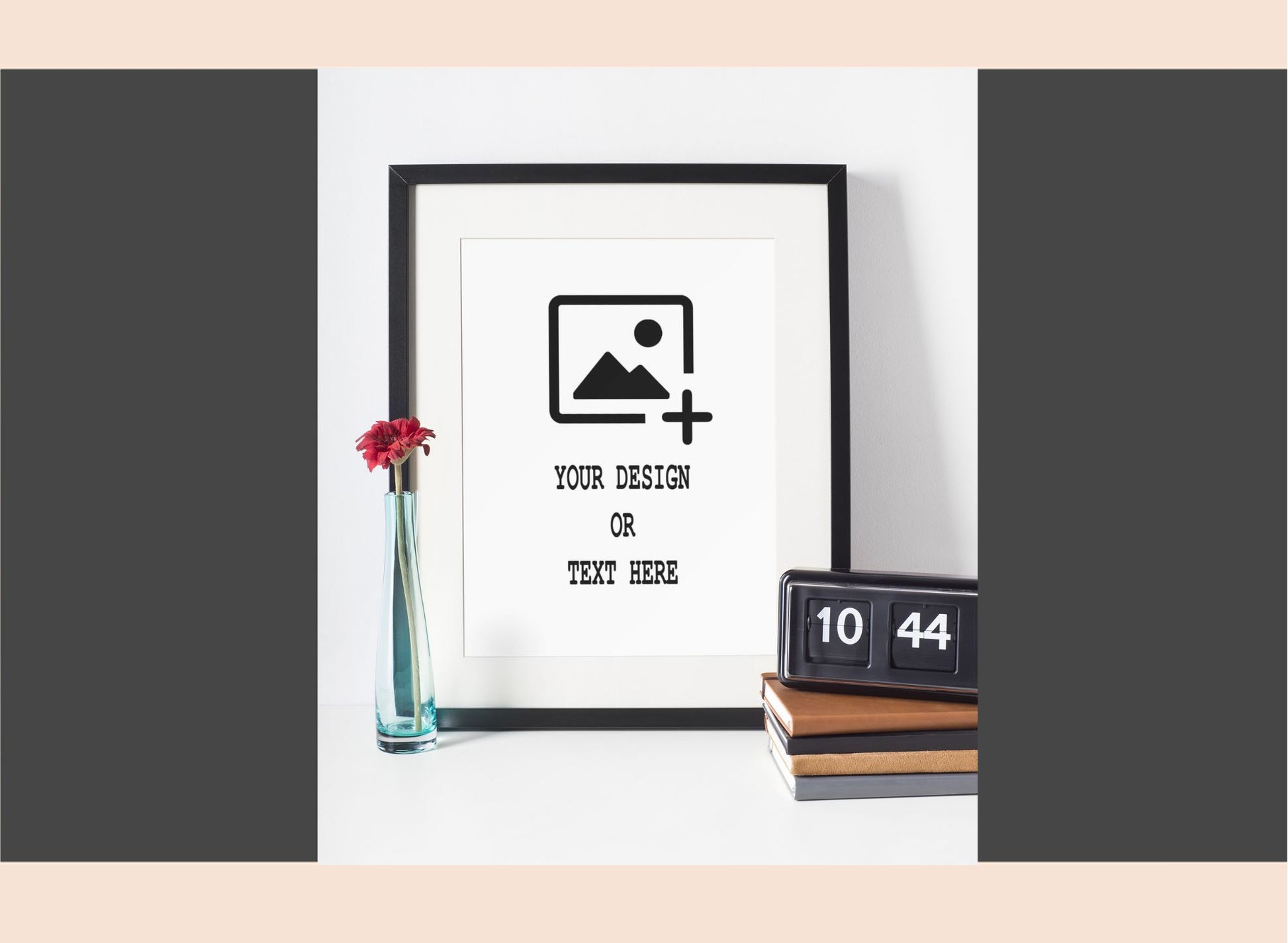 Framed mockup with customizable text and design area, placed on a white surface with decorative items.