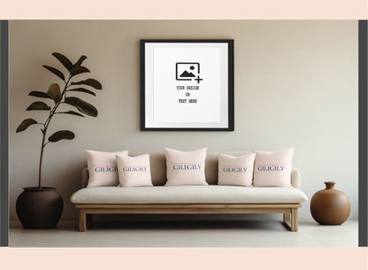 Framed artwork on a wall above a sofa with decorative pillows in a living room setting.
