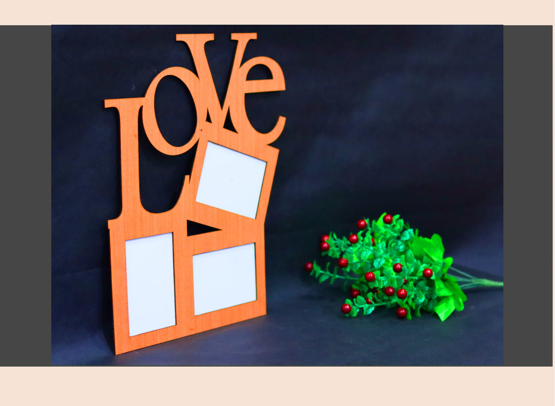 Orange 'LOVE' photo frame with white spaces and a small green plant with red berries on a dark background