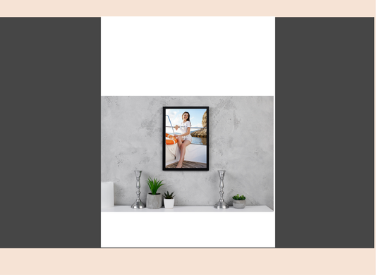 Framed picture of a woman on a wall in a room with decor elements.