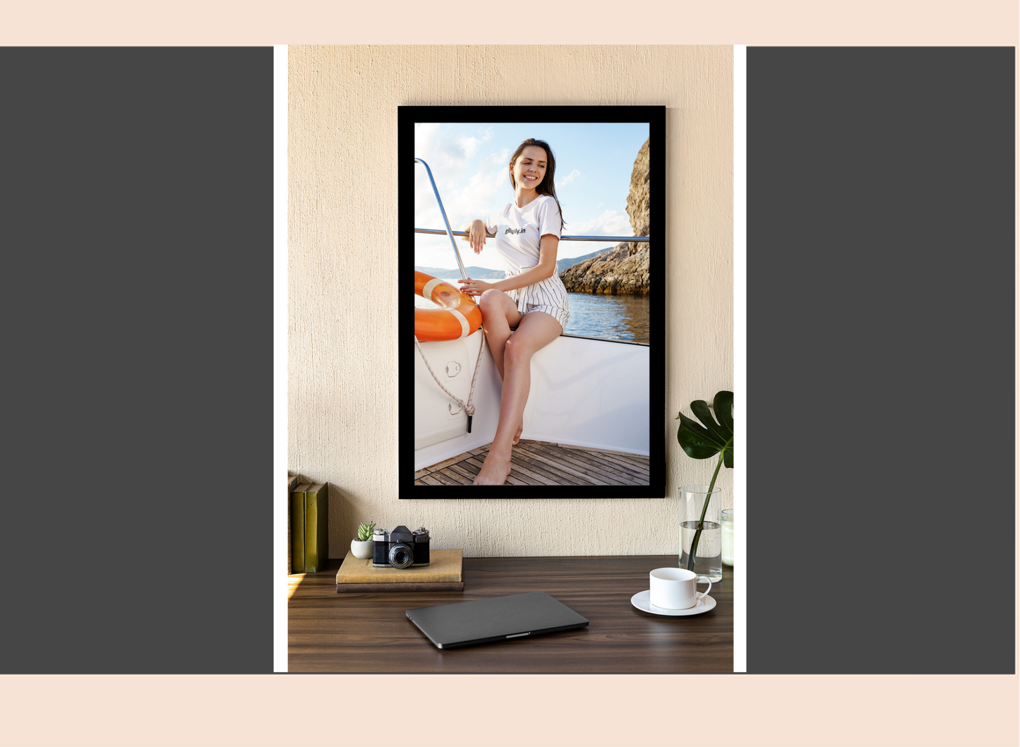 Framed photograph of a woman on a boat displayed on a wall in a room.