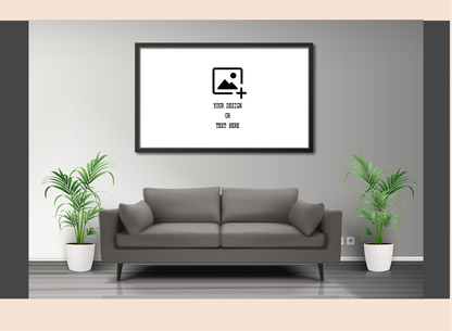Gray sofa in a living room with a framed picture on the wall