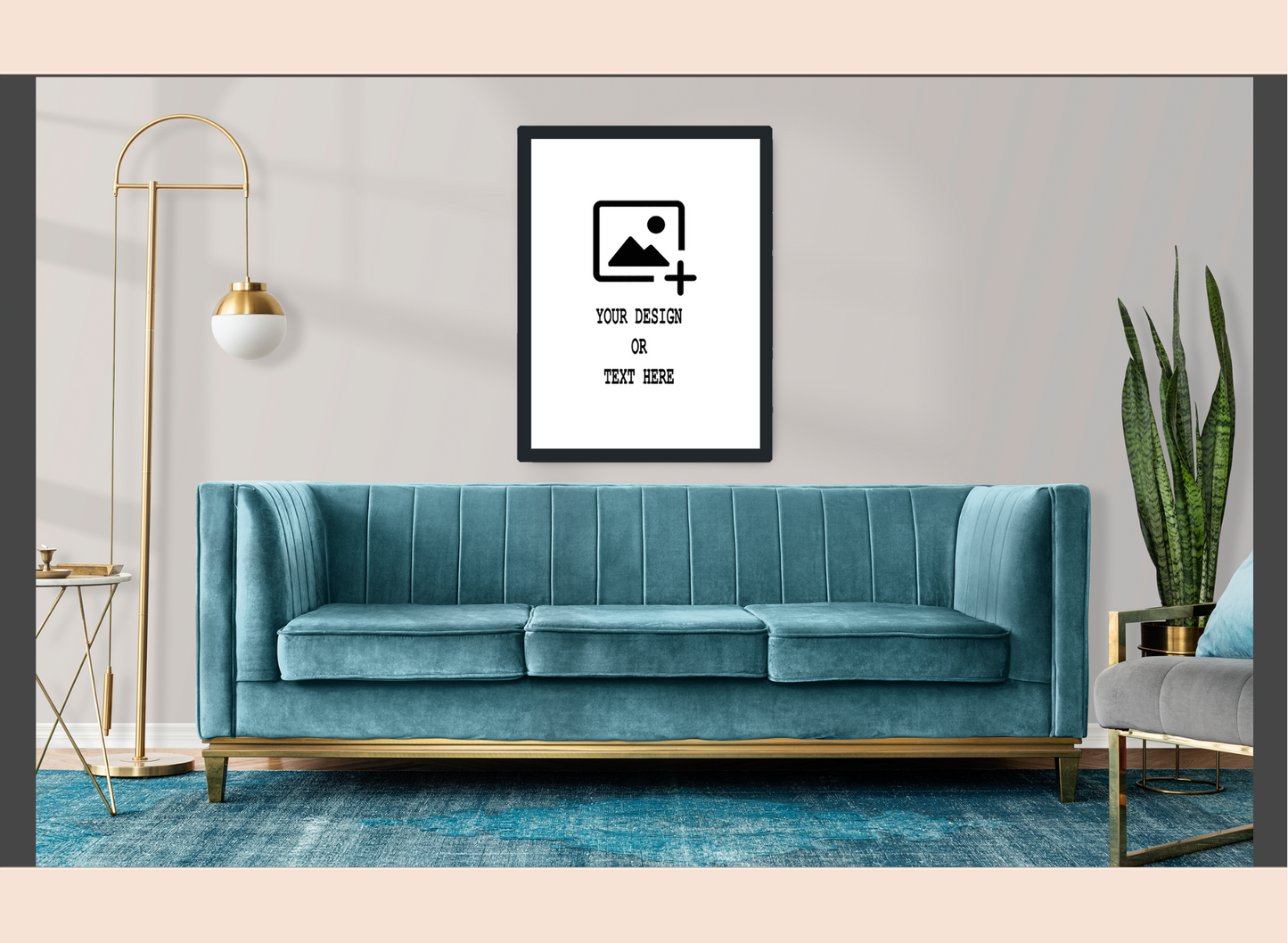Teal sofa in a living room with a decorative frame on the wall.