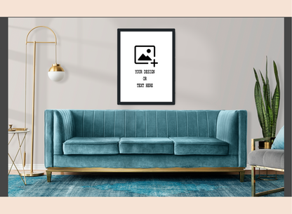 Teal sofa in a living room with a decorative frame on the wall.