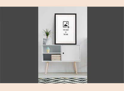 Modern interior with a white cabinet, plant, and framed picture on a gray background