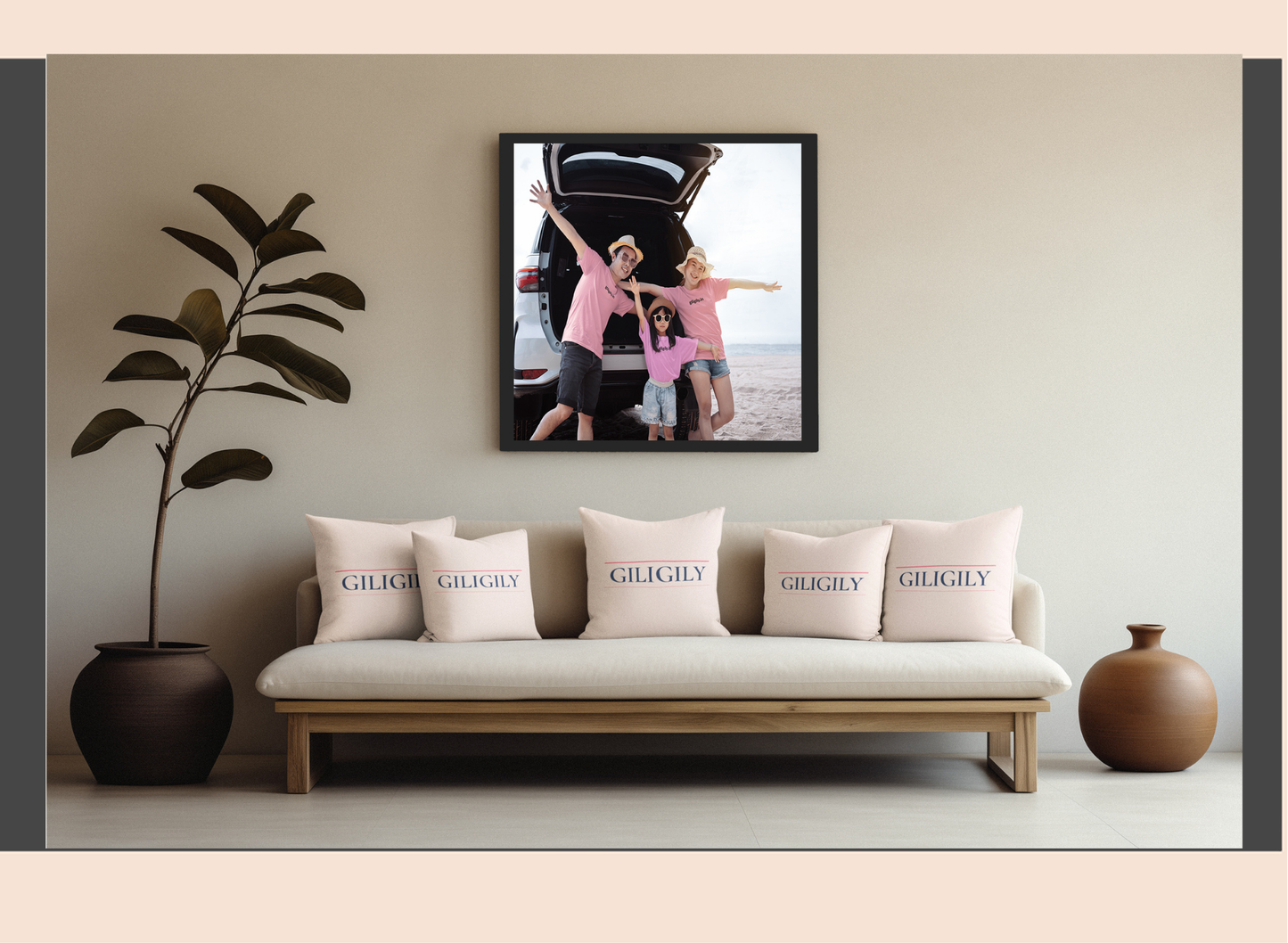 Sofa with 'GILKINS' cushions, framed family photo above, and decorative plants on either side.