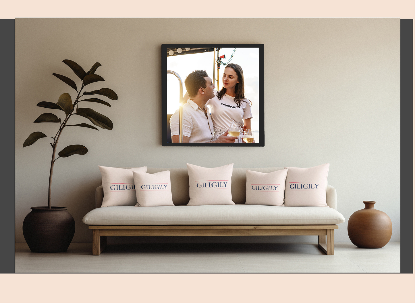 Sofa with 'Giglioli' pillows, decorative plant, and framed photo of a couple on the wall.