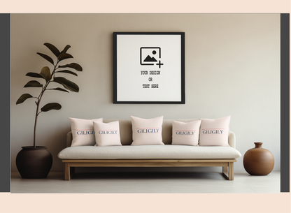 Framed artwork on a wall above a sofa with decorative pillows.