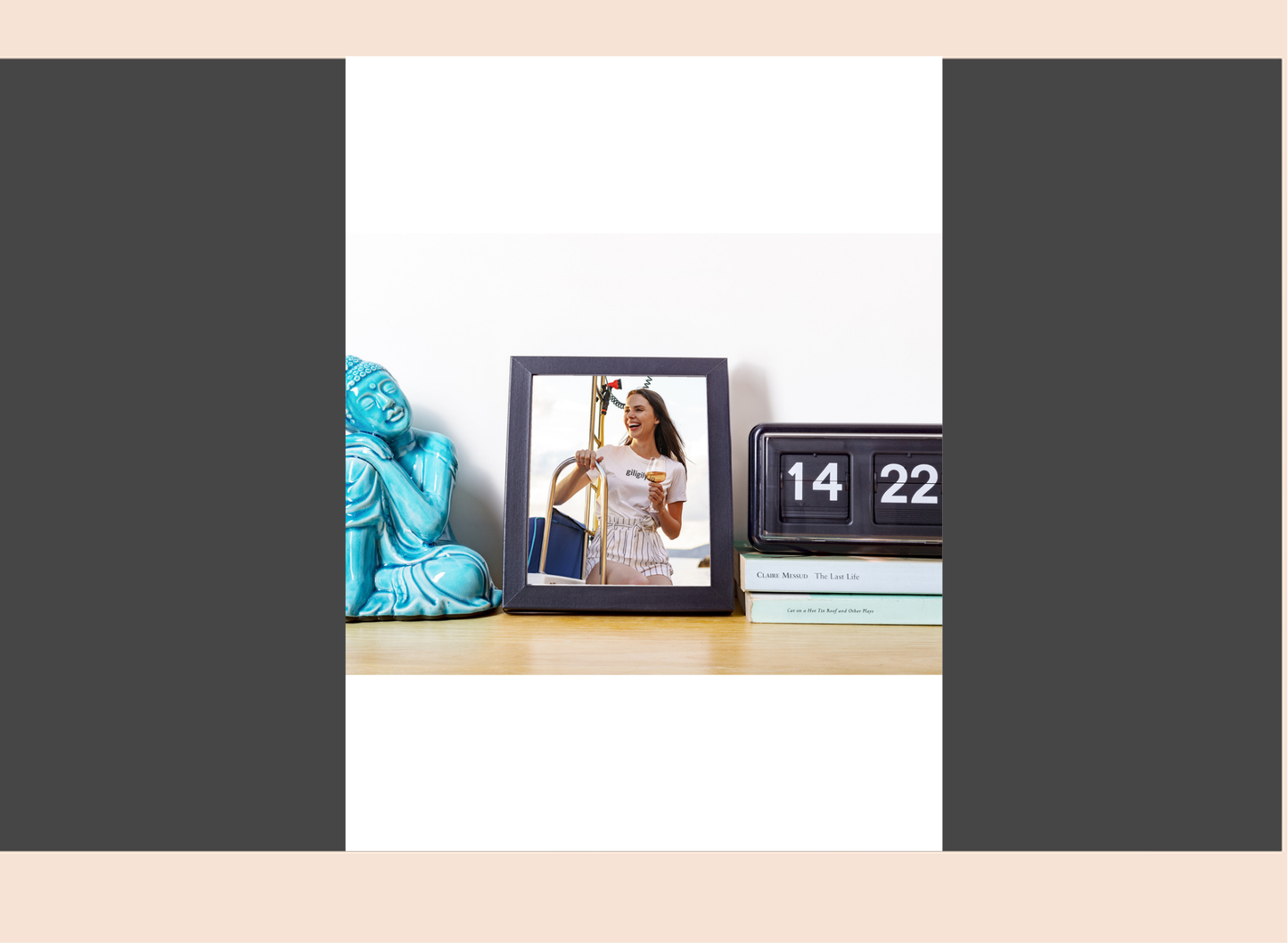 Decorative items including a blue statue, photo frame with a woman's picture, and a calendar on a table.