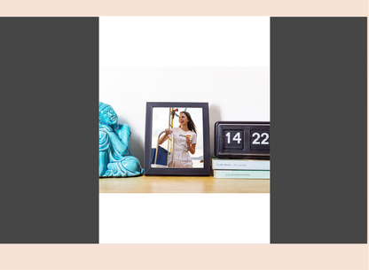 Decorative items including a blue statue, photo frame with a woman's picture, and a calendar on a table.