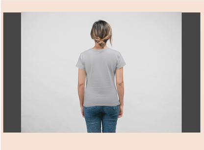 Person wearing a plain gray t-shirt and blue jeans on a light gray background