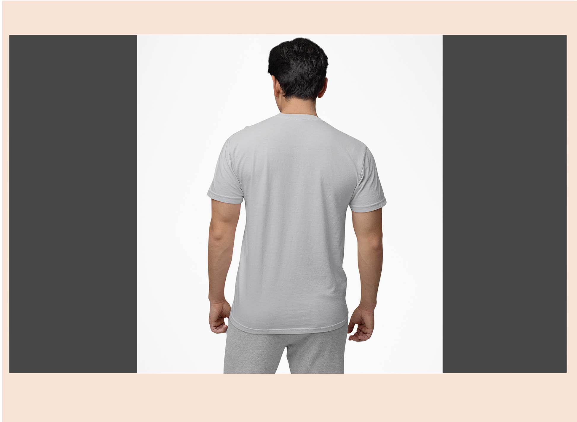 Man wearing a gray t-shirt and pants on a white background