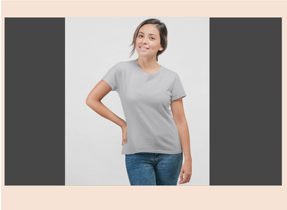 Woman wearing a gray t-shirt and blue jeans on a light gray background