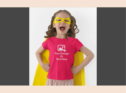 Child wearing a pink t-shirt with customizable design area, yellow cape, and mask on a white background