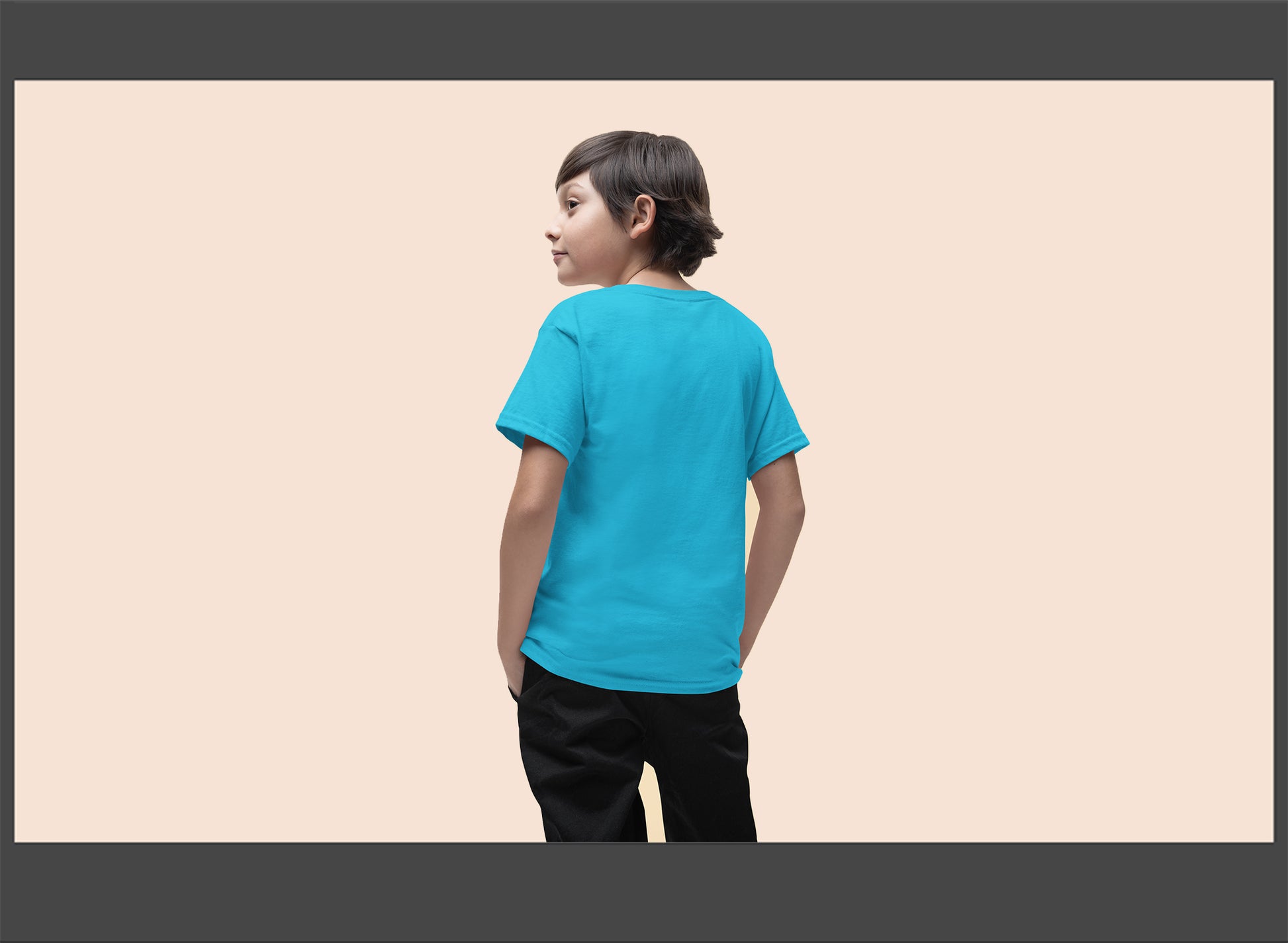 Child wearing a blue t-shirt on a beige background