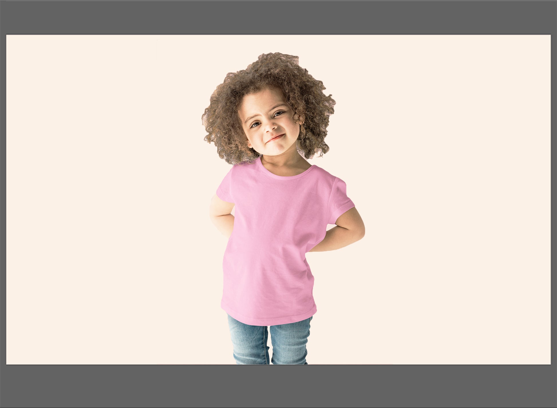 Child wearing a pink shirt on a plain background