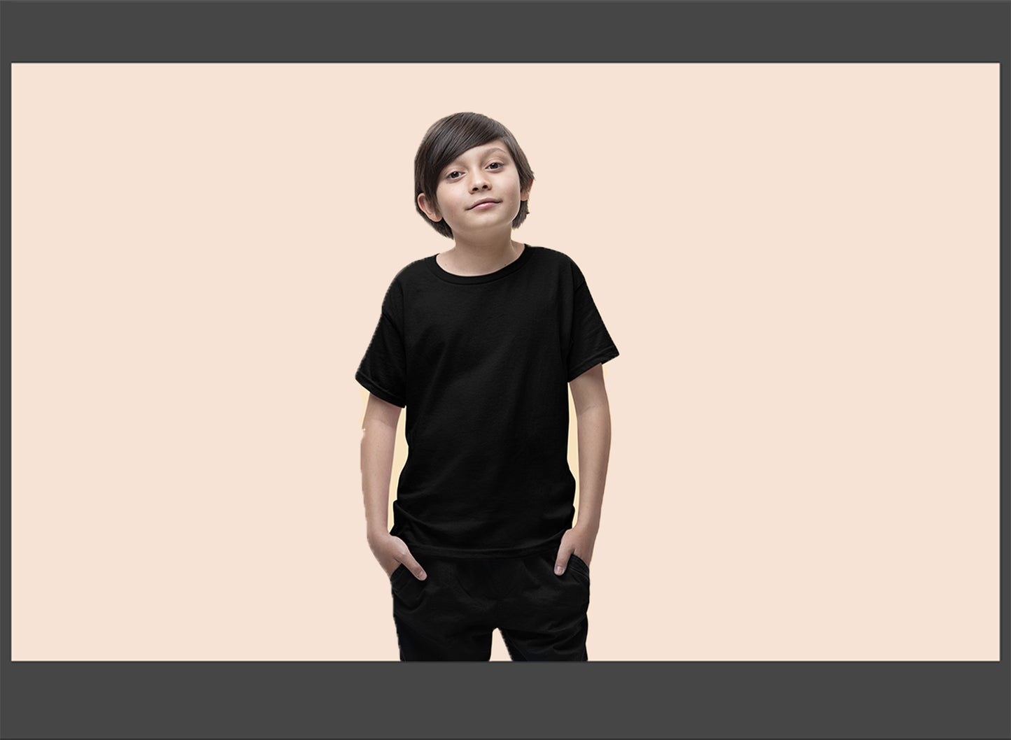 Kid wearing a black t-shirt on a beige background