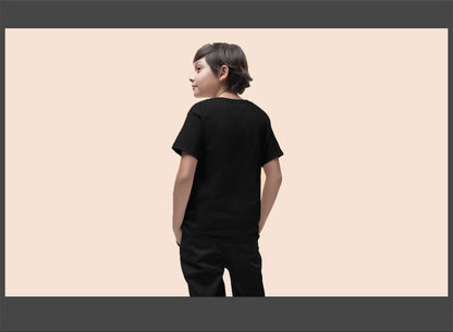 Person wearing a black t-shirt and pants on a beige background
