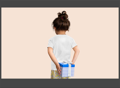 Child holding two gift boxes against a beige background