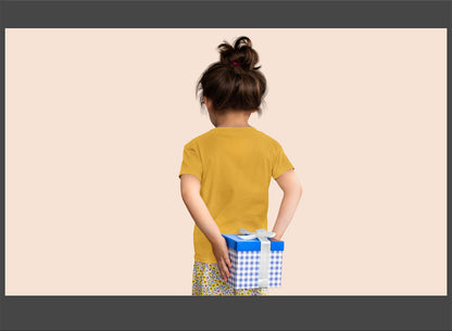 Child holding a gift box with a plain background