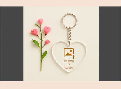 Heart-shaped keychain with floral design on a light pink background