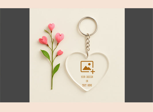 Heart-shaped keychain with floral design on a light pink background