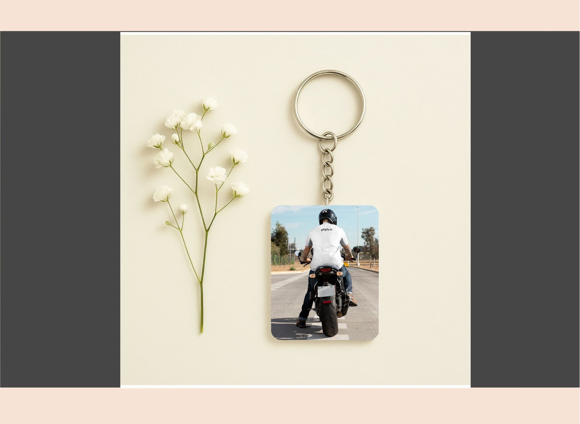 Keychain with photo of person on a motorcycle next to a small plant on a beige background