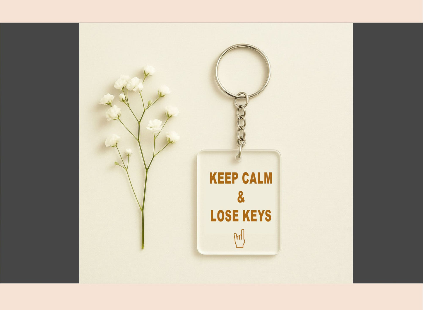 Keychain with 'Keep Calm & Lose Keys' message on a neutral background