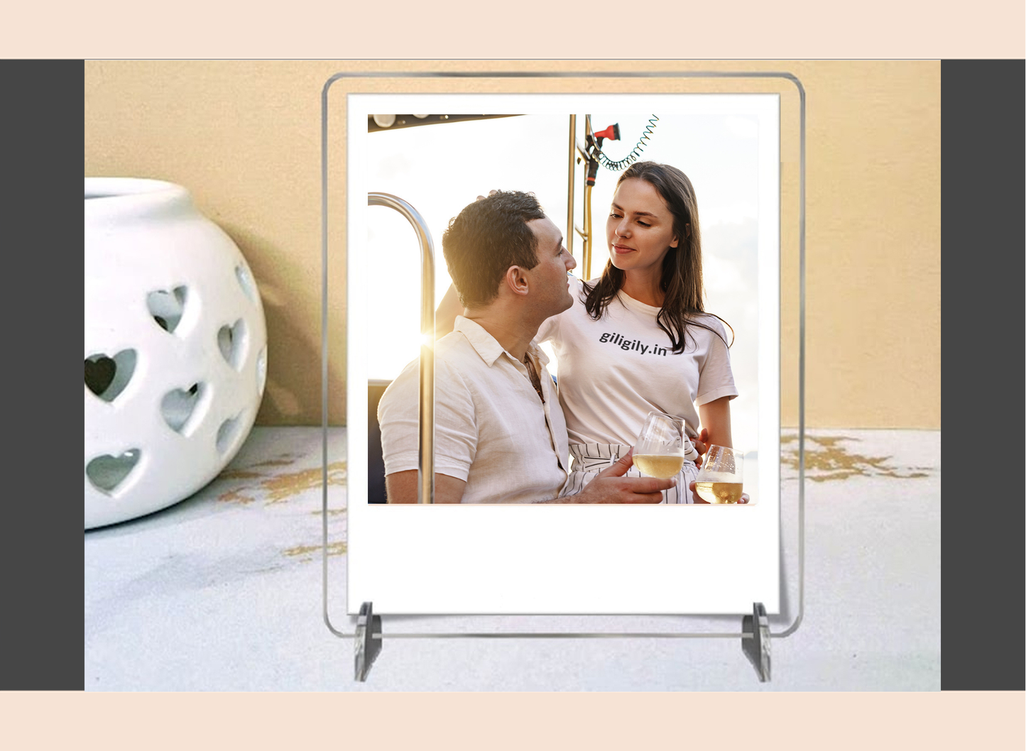 Acrylic polaroid frame with a couple on a stand against a beige background
