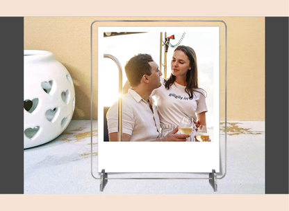 Acrylic polaroid frame with a couple on a stand against a beige background